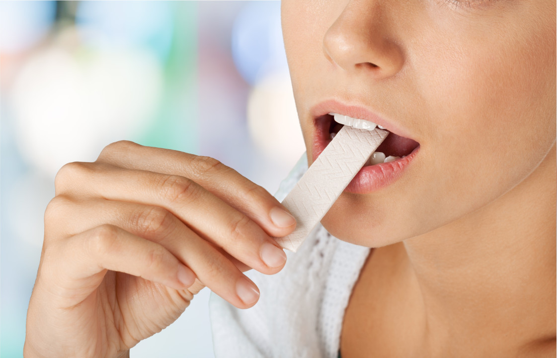 Close up on a beautiful girl while enjoying  gum